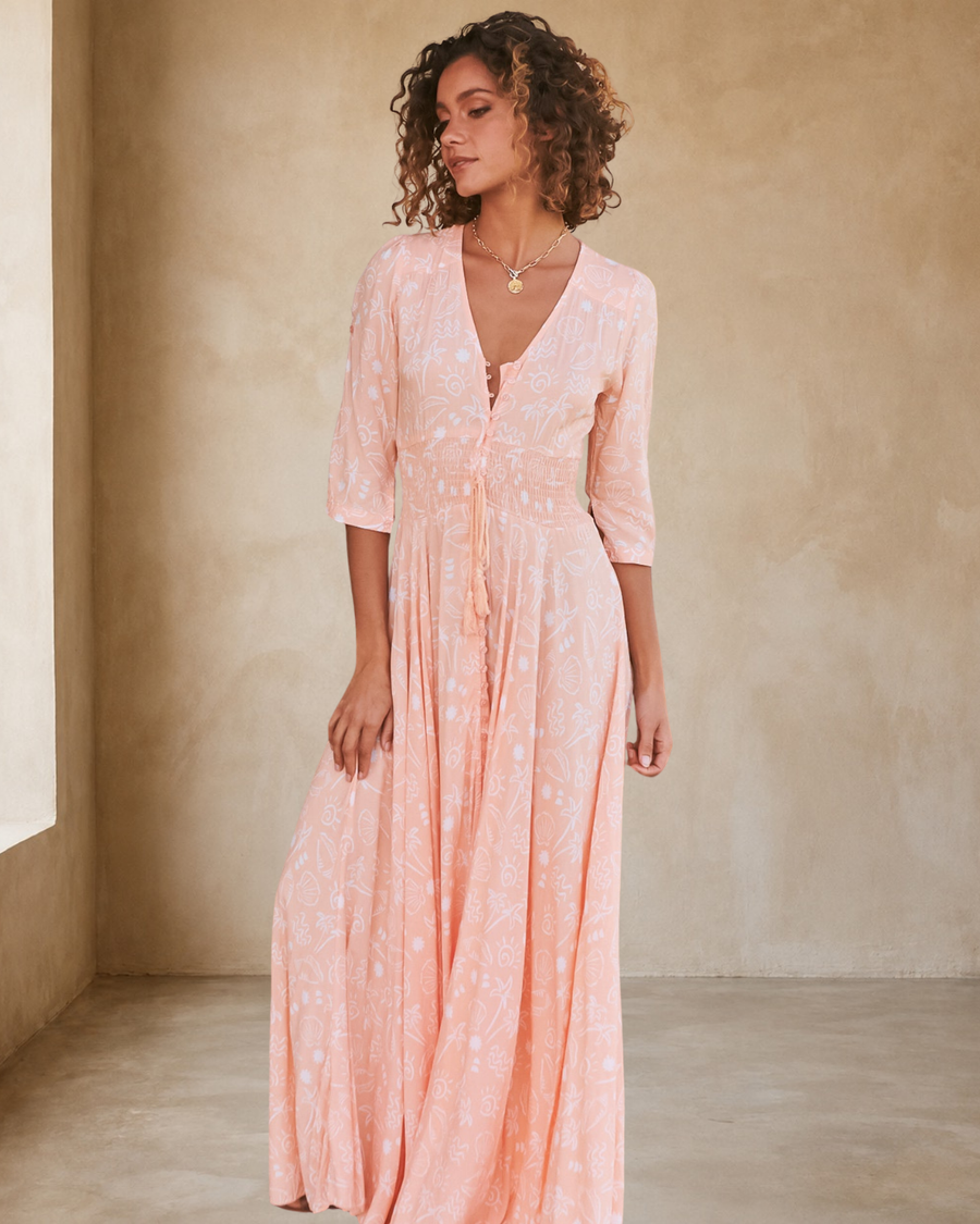 JAASE - Indiana Maxi Dress: Lace Back Shirred Waist A Line Dress with Handkerchief Hemline in Peach Island Print